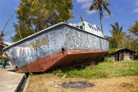Banda Aceh, Indonesia - January 5, 2020. Sea boat thrown in 2004 by a tsunami wave several kilometers from the coastline into the residential sectorのeditorial素材