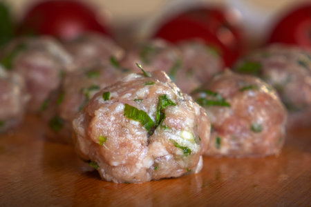 Raw homemade meatballs with minced meat with herbs. Close-upの写真素材