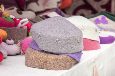 Traditional Asian headdresses from a multicolored felt with national ornament. Handmade