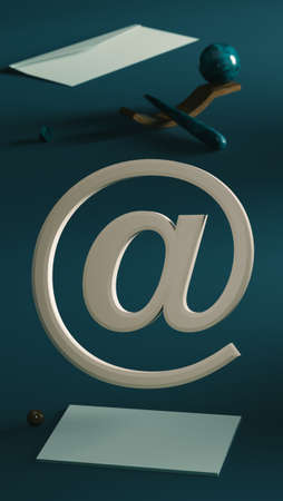 E-mail symbol on desk background with envelope, pen and paper. 3d rendering.の写真素材
