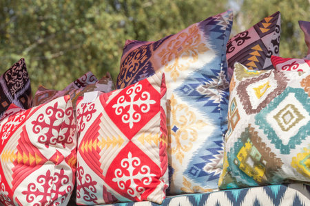 Handmade felt products - pillows and bedspreads with embroidery in traditional Kazakh style. street tradingの写真素材