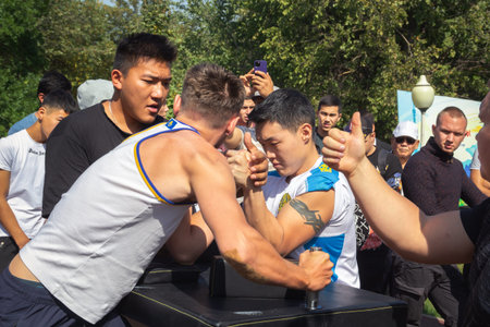 Almaty, Kazakhstan - September 18, 2022. Arm wrestling competition in the city park