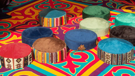 Traditional Asian headdresses from a multicolored felt with an embroidered colored thread of national ornament.の写真素材