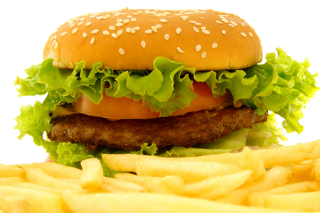 Tasty burger with beef or chiken, cheese and vegetables isolated on whiteの写真素材