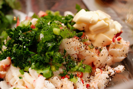 A lobster with herbs salad close up photoの写真素材