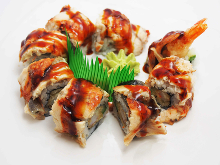 Sushi rolls japanese food isolated on white background. California Sushi roll with tuna, vegetables and unagi sauce closeup. Japan restaurant menuの写真素材