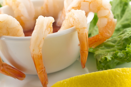 Seafood set with Lobsters, Clams, Fish, Blue Clabs, Big Prawns, Mussels and Calamari Squids with pieces of lemon & vetgetablesの写真素材