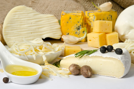 A close up of cheeseboard with different kinds of cheese for an appetizer