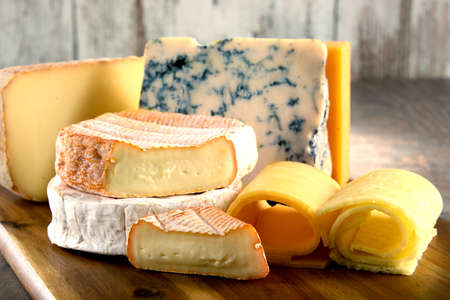 A close up of cheeseboard with different kinds of cheese for an appetizerの写真素材