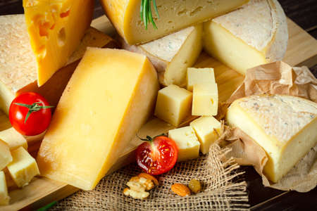 A close up of cheeseboard with different kinds of cheese for an appetizerの写真素材