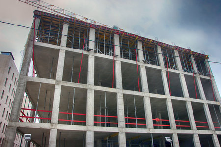 concrete building under construction with monolithic reinforced concrete frame in Moscow, Russia
