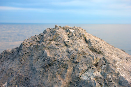 beautiful wild limestone cliff on backdrop of sea horizon in Crimeaの写真素材