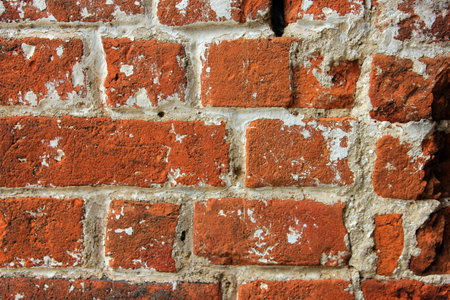 high quality texture of oldest red brick masonry with white cement mortar closeup