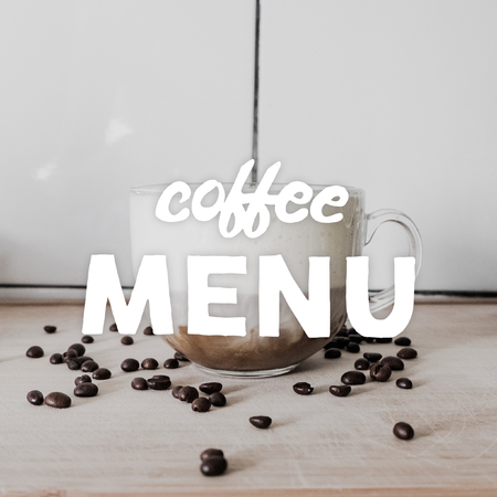 Transparent cup of cappuccino, coffee beans scattered on the table and hand written quote Coffee menu.の写真素材