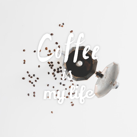 Opened coffee maker, coffee beans scattered on the table and hand drawn quote Coffee is my life.の写真素材
