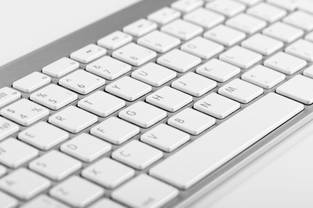 Close-up English computer keyboard with bokeh effect 