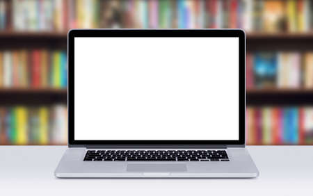 Front view of modern laptop mockup with white blank screen on the office desk. Office room on the background.の写真素材