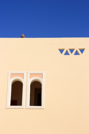 the wall of arabian house with windowsの写真素材