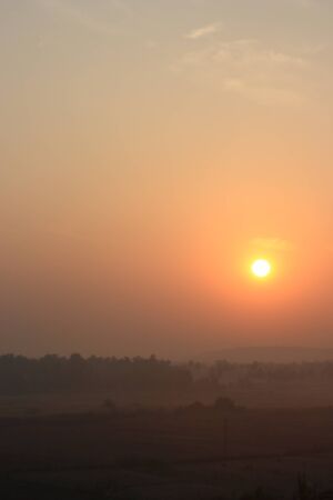 The sun just rising over the horizon Tropical sunriseの写真素材