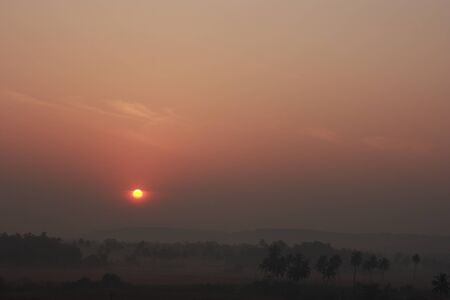 The sun just rising over the horizon Tropical sunriseの写真素材