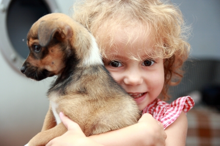 Little girl holding her pet の写真素材
