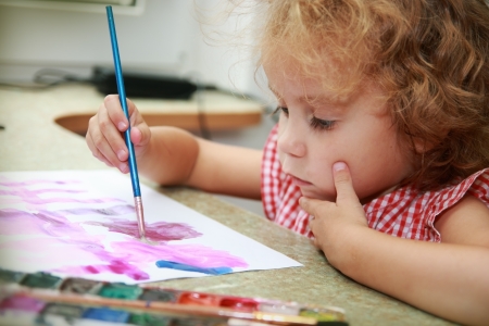 Creative little girl draws  Budding artist の写真素材