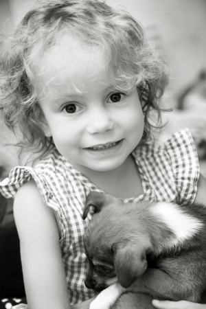 Little girl holding her pet I love my dog の写真素材
