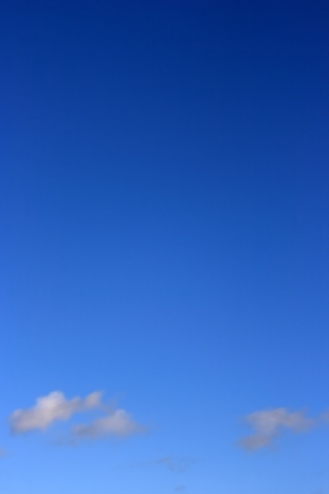 Clear blue sky and small cloudsの写真素材