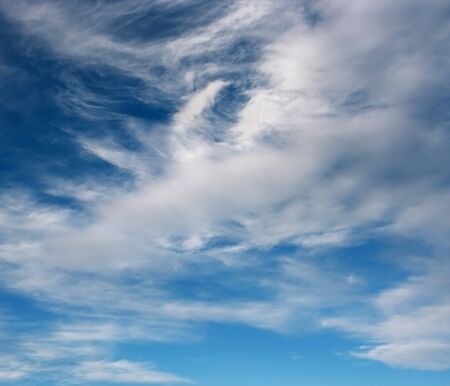 Spring sky over horizon and clouds の写真素材