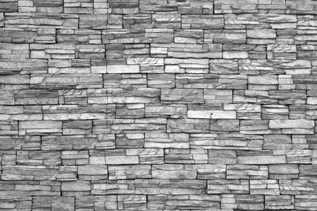 Modern brick wall (monochrome photo).Brick wall as background.