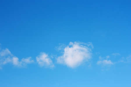 Sky over horizon and white clouds の写真素材