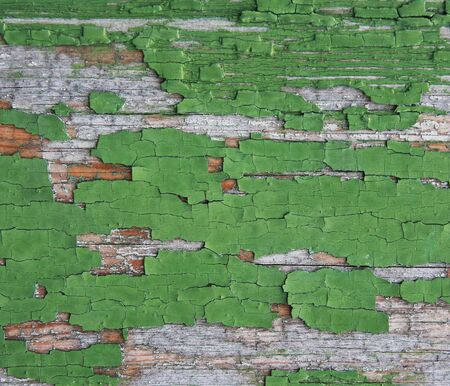 Green old painted wooden background  Background of green, peeling paint on an old wall の写真素材