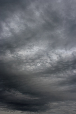 Dark ominous grey storm clouds like armagedon. The storm clouds as if Armageddon.の写真素材