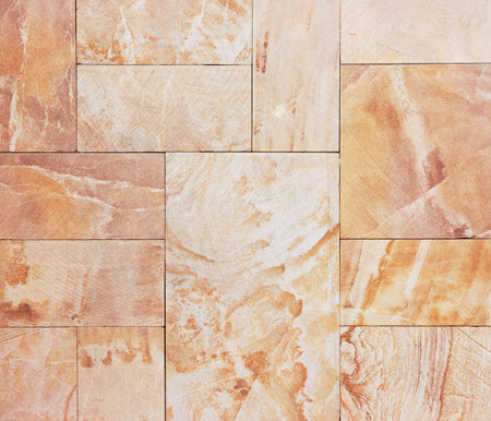 Wall from granite tiles with natural pattern  Granite with natural pattern 