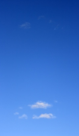 Small, barely visible clouds against the blue sky. Blue sky and small clouds..の写真素材