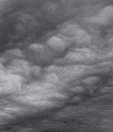 Storm clouds as if armageddon. Rainy clouds over horizon.の写真素材