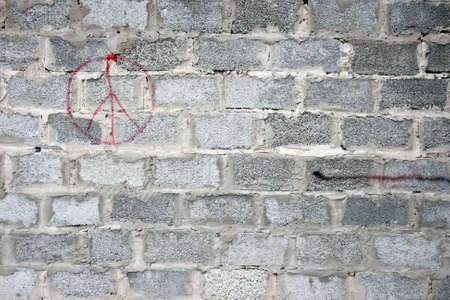 Wall in a poor area of the city  Wall with peace signの写真素材