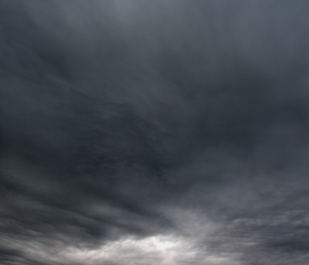 Ominous storm clouds as if armageddon  The grey storm clouds over horizon  の写真素材