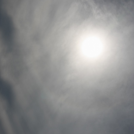 Dark sky with sun  The grey stormy clouds の写真素材
