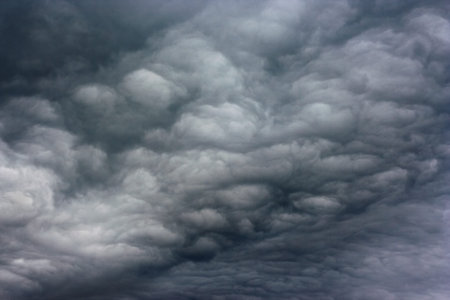 Dark clouds as if armageddon Stormy clouds over horizon