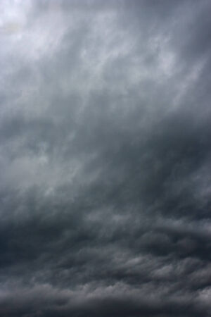 Storm clouds as if armageddon Rainy clouds over horizonの写真素材
