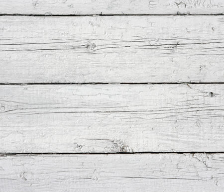 White rustic fence. Weathered wooden planks in a row white enamel.の写真素材