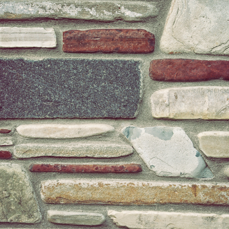 Ancient wall from slim granite brick.Granite rick wall as background. の写真素材