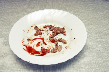 Dirty plate at the end of a tomato sauce pasta  Dirty dish の写真素材