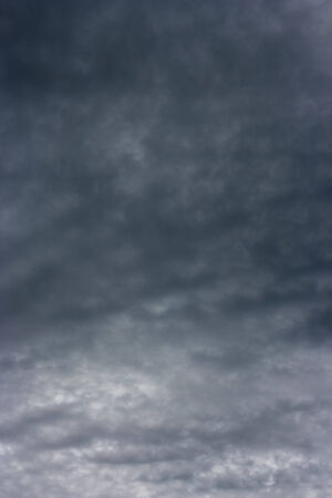 Dark clouds  The stormy clouds over horizon  の写真素材