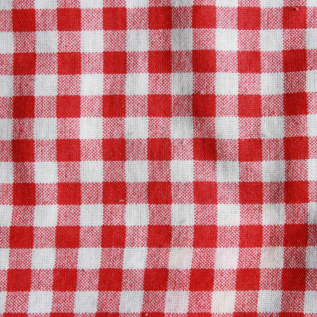Texture of a red and white checkered picnic blanket  Red linen crumpled tablecloth の写真素材