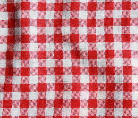 Texture of a red and white checkered picnic blanket  Red linen crumpled tablecloth の写真素材