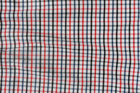 Texture of a checkered picnic blanket. Striped crumpled tablecloth.の写真素材