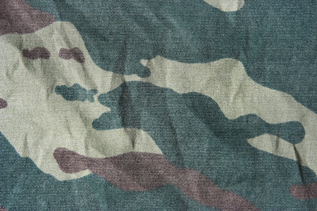 Khaki camouflage texture. Background of green camo pattern. の写真素材