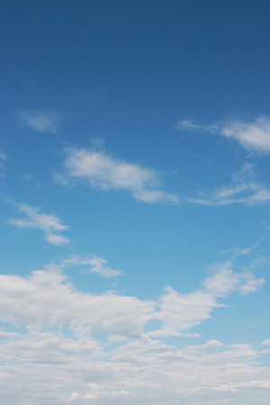 Sky over horizon and white clouds.の写真素材